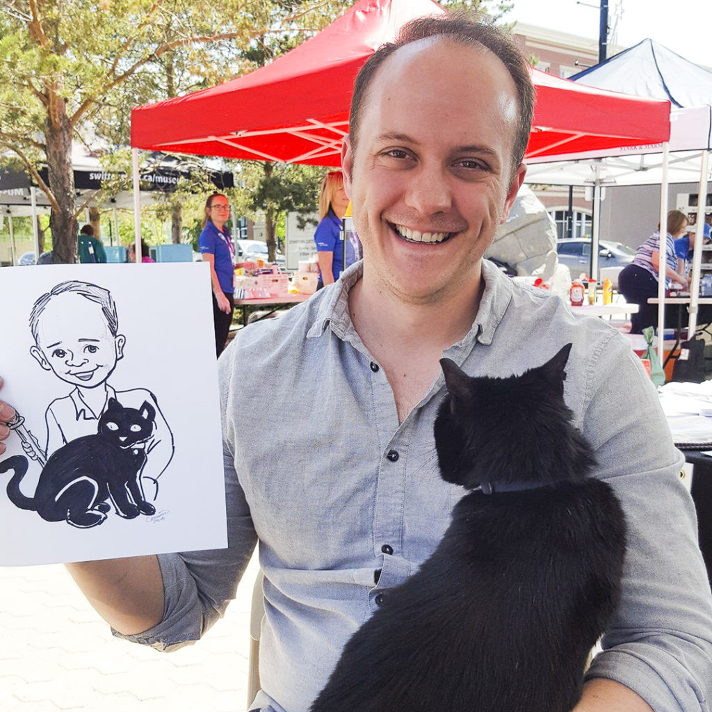 man with his pet cat caricature festival entertainer