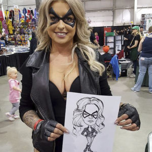 Woman dressed as superhero with her custom artwork