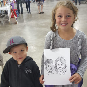 two young siblings with caricature of themselves