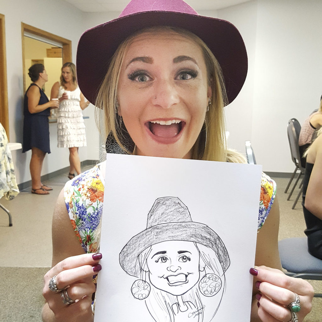 Young woman very happy about caricature art