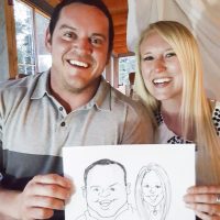 Guests at a rural wedding outside of Regina with caricatures